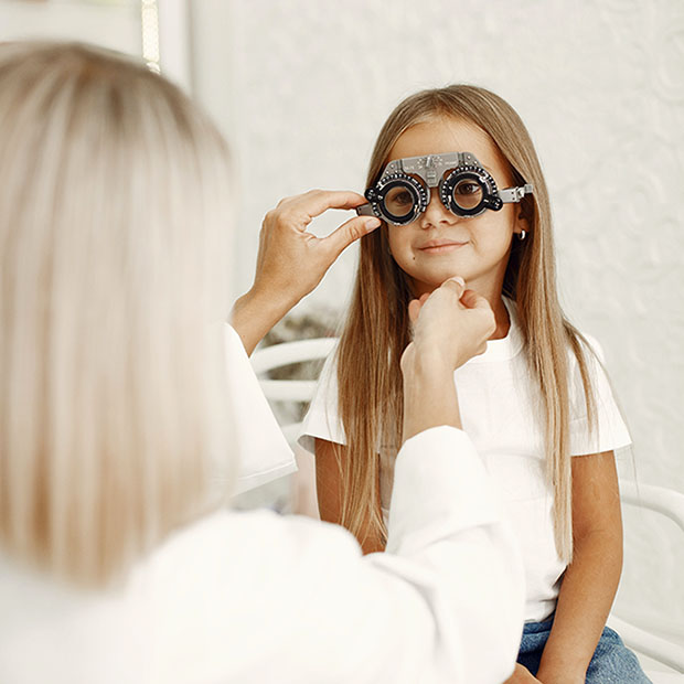 girl receiving eye exam